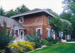 Detail view of Kitchen porch at grade change at West elevation.