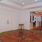 Custom Designed Floor in Vestibule in two mahogany woods.